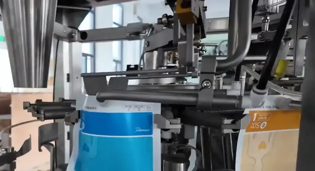 A-pair-of-suction-cups-pulls-the-two-layers-of-film-on-the-bag-apart