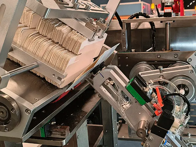 A-vacuum-suction-cup-attaches-to-the-surface-of-the-front-billet-and-pulls-it-out-of-the-billet-stack