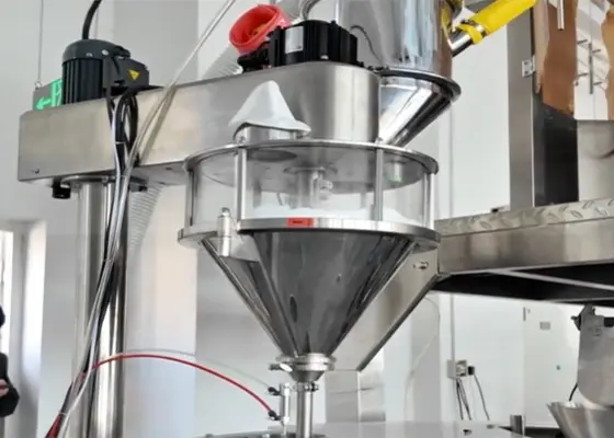 An-auger-filler-delivers-a-measured-dose-of-powder-or-granules-through-a-funnel-nozzle-into-the-open-pouch