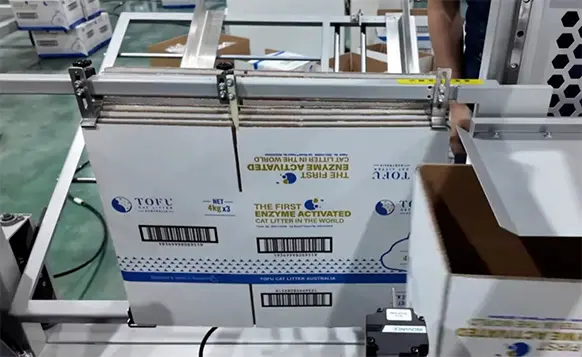 Flat-corrugated-cardboard-blanks-are-loaded-into-the-magazine-at-the-back-of-the-machine-1